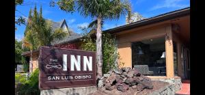 a sign for the inn in front of a house at Inn at San Luis Obispo in San Luis Obispo
