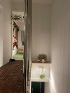 a bathroom with a sink and a mirror at busan UA Stay House 우아 스테이 in Busan