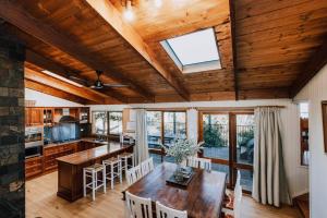 a kitchen and dining room with a wooden ceiling at Ilkley House - A Refreshing Family Rural Getaway in Eurunderee