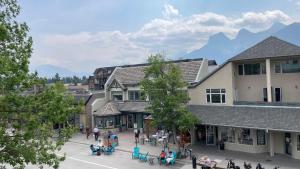 an overhead view of a street in a town with mountains at unit #302 Mountain view 2 beds in DT in Canmore