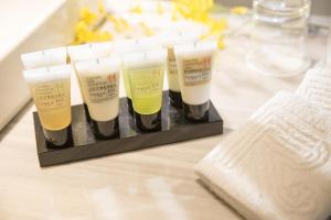 a group of four candles sitting on a table at Riverview Suites Taipei in Taipei