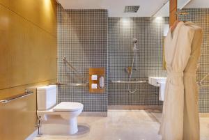 a bathroom with a toilet and a shower at The Westin Shenzhen Nanshan in Shenzhen