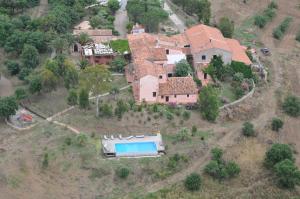 an aerial view of a house with a swimming pool at Tenuta Luogo Marchese in Pollina