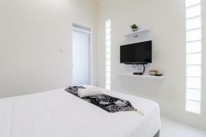 Μια τηλεόραση ή/και κέντρο ψυχαγωγίας στο Rumah Teteh - Seturan