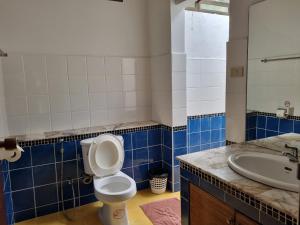 a bathroom with a toilet and a sink at Samui Honey Backpacker Bungalow in Choeng Mon Beach