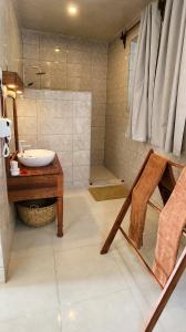 a bathroom with a sink and a shower at The Zanzibari in Nungwi