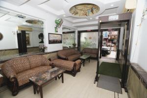 a living room with couches and tables in a store at Hotel Silver Arc - Karol Bagh New Delhi in New Delhi