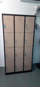 three lockers with blue buttons on them in a room at Langkawi-Village Mix Dormitory in Pantai Cenang
