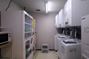 a laboratory with machines and a stool in a room at Kumamoto Tokyu REI Hotel in Kumamoto