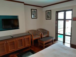 TV o dispositivi per l'intrattenimento presso Wonderland Private Pool Villas at Port Dickson