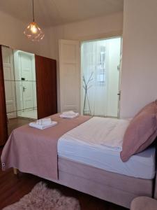 Postel nebo postele na pokoji v ubytování Queen of Stay - Apartment Lili