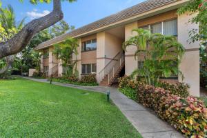 a building with a lawn in front of it at Unrivaled S Kihei Maui location! Walk to it all! in Kihei