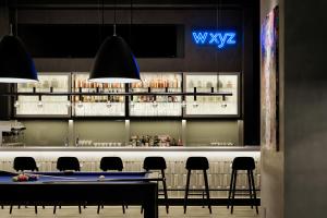 a bar with chairs and a pool table at Aloft by Marriott Osaka Umeda in Osaka +133 photos