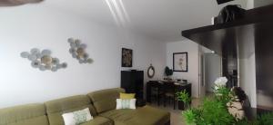 a living room with a couch and a table at PC CHICLANA, PARKING, WIFI, aire, confort in Chiclana de la Frontera