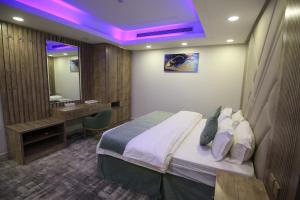 Katil atau katil-katil dalam bilik di شقق نيروز ان للشقق المخدومة - Newroz N Serviced Apartments +17 gambar