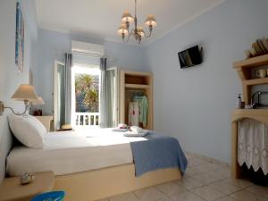 Postel nebo postele na pokoji v ubytování Tasoula Guest House