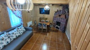 an overhead view of a living room with a couch and a fireplace at Cabana 2 Râuri in Bratca