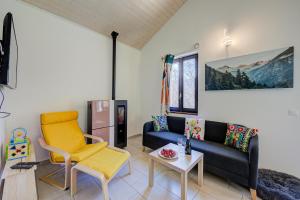 a living room with a couch and a table at Ca' Mia Panoramica - Happy Rentals in Lugano