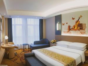 a hotel room with a large bed and a chair at Vienna International Hotel Chongqing Ranjiaba in Chongqing