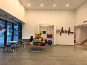 a store with chairs and tables in a room at 7Days Inn Chongqing Longtou Temple North Train Station North Plaza Branch in Chongqing