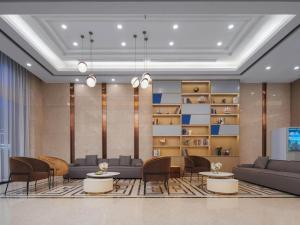 Area soggiorno di Kyriad Hotel Baoying Jinyuan Square High-speed Railway Station
