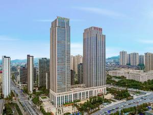 an aerial view of a city with tall buildings at Vienna International Hotel Chongqing Central Park 5 0 in Chongqing