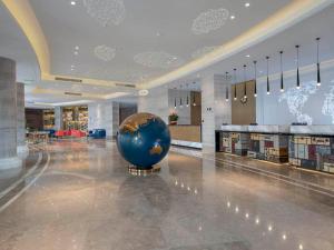 Khu vực sảnh/lễ tân tại Kyriad Marvelous Hotel Tai'an City Hall Plaza