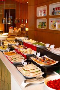 a buffet line with many different types of food at The Westin Shenzhen Nanshan in Shenzhen