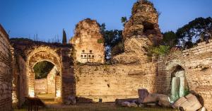 an old brick building with two arches on it at By The Sea - central with free parking in Varna City