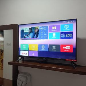 a flat screen tv sitting on top of a shelf at Anggerik Garden Hotel - AG Hotel in Sitiawan