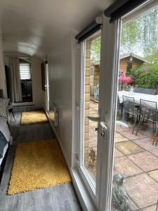 a room with a sliding glass door and a patio at Quay Central in Exeter