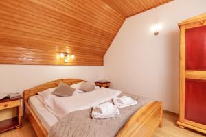 Postel nebo postele na pokoji v ubytování KRALjEVI KONACI ZLATIBOR + 37 fotografií