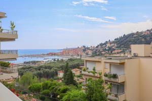 a view from the balcony of a apartment building at « La Grande Résidence » Vue Mer, Piscine in Menton