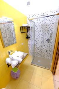 a bathroom with a shower and a sink at Donna Elena B&B in Naples