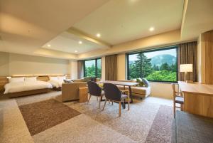 Ein Bett oder Betten in einem Zimmer der Unterkunft Hakone Kowakien Hotel