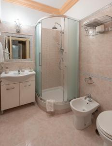 a bathroom with a shower and a sink and a toilet at Maristella in Positano
