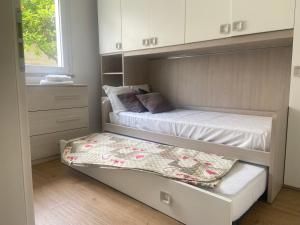 En eller flere senge i et værelse på Casa Olivastro Millenario A