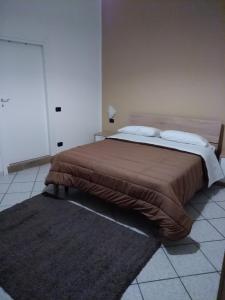 Postel nebo postele na pokoji v ubytování Al cortile