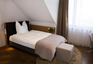 Postel nebo postele na pokoji v ubytování Hotel am Markt