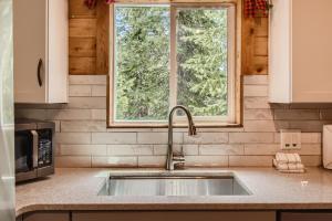 a kitchen with a sink and a window at Gasthaus Breck home in Breckenridge +40 photos