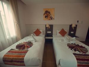 Ένα ή περισσότερα κρεβάτια σε δωμάτιο στο Hotel Krishna Kathmandu