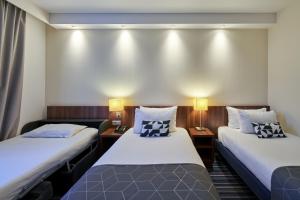 Кровать или кровати в номере Holiday Inn Express Strasbourg Centre, an IHG Hotel