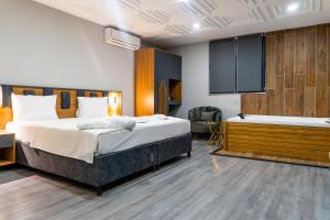 Postel nebo postele na pokoji v ubytování GRAND MOON HOTEL