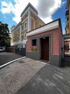 a building with a door on the side of a street at La Casetta in Rome