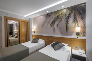 Postel nebo postele na pokoji v ubytování Alba Resort Hotel - Ultra All Inclusive