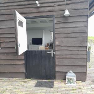 an open door of a house with a door at Cosy Cottage 