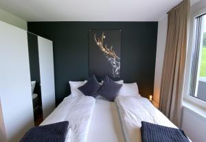 Postel nebo postele na pokoji v ubytování Ferienhaus Röns