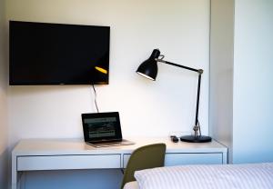 TV a/nebo společenská místnost v ubytování Ferienhaus Röns