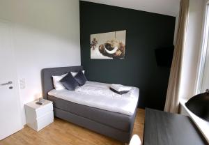Postel nebo postele na pokoji v ubytování Ferienhaus Röns