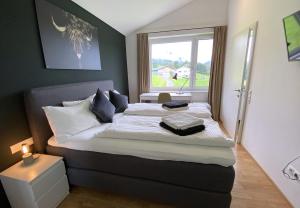 Postel nebo postele na pokoji v ubytování Ferienhaus Röns